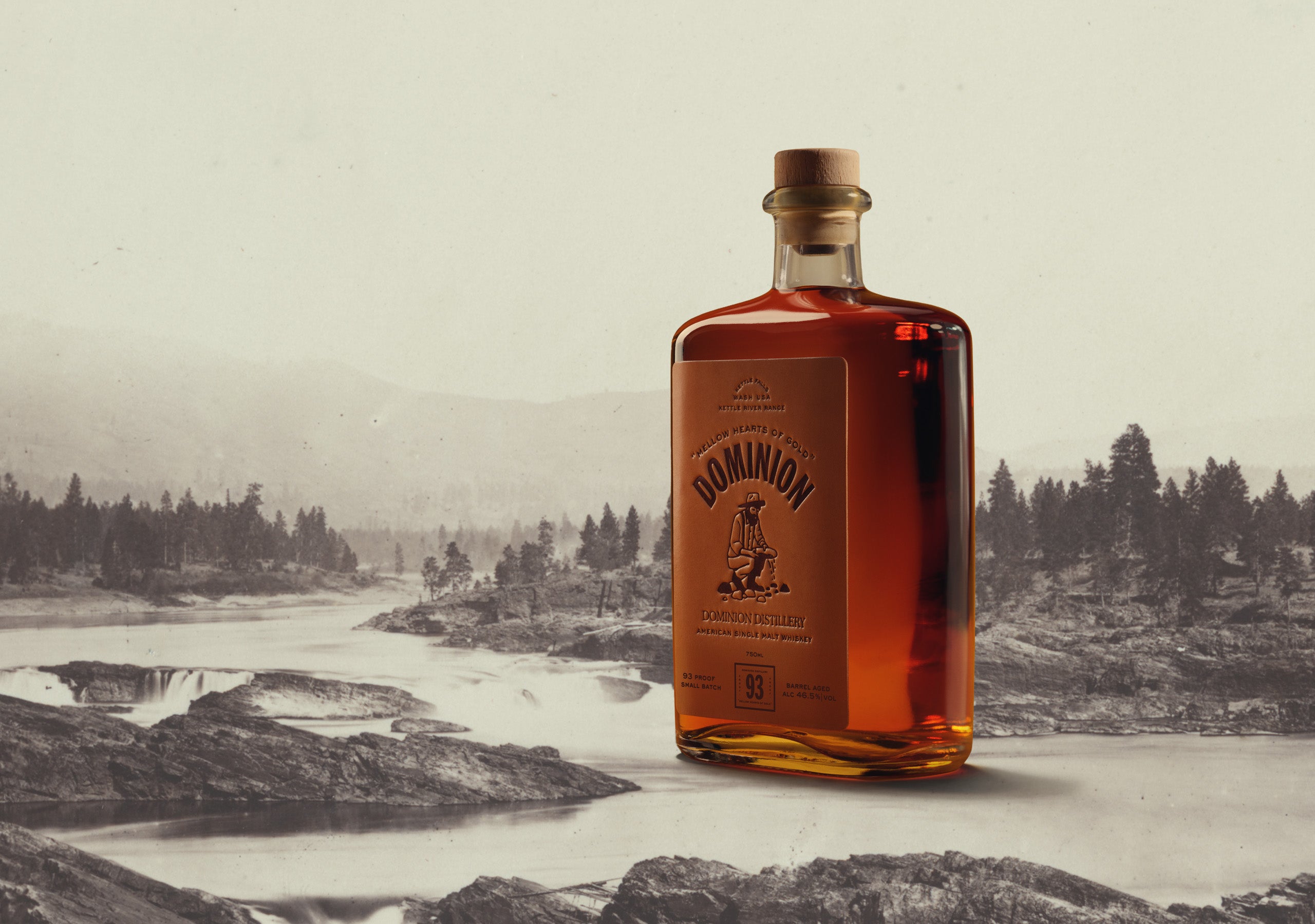 Bottle of Dominion Whiskey with a scenic background